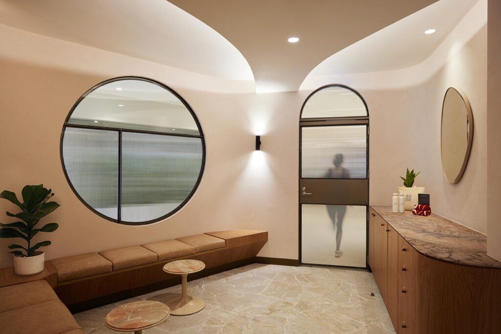 modern, bright interior, circular window, arch, curved ceiling, earthy, bronze, timber, leather, marble counter, crazy paving
