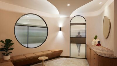 modern, bright interior, circular window, arch, curved ceiling, earthy, bronze, timber, leather, marble counter, crazy paving